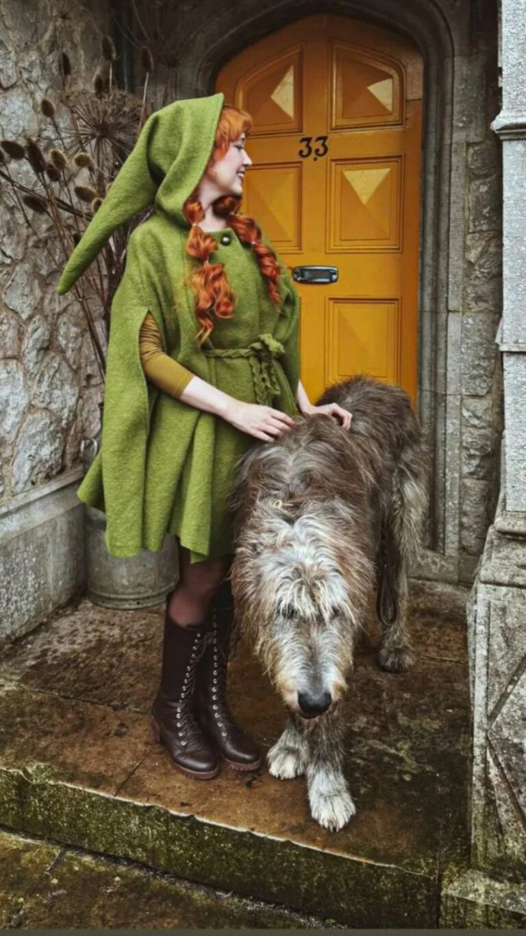 Rebecca wears Cape Philomena in the color moss green